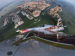 Dario Costa of Italy flies over the city of Venice